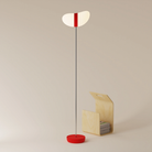 The poppy Baltra Floor Light from Gantri with the chrome rod option.