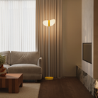 The sunrise Baltra Floor Light from Gantri with the white rod option in a lounge.