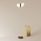 The walnut Baltra Floor Light from Gantri with the white rod option.