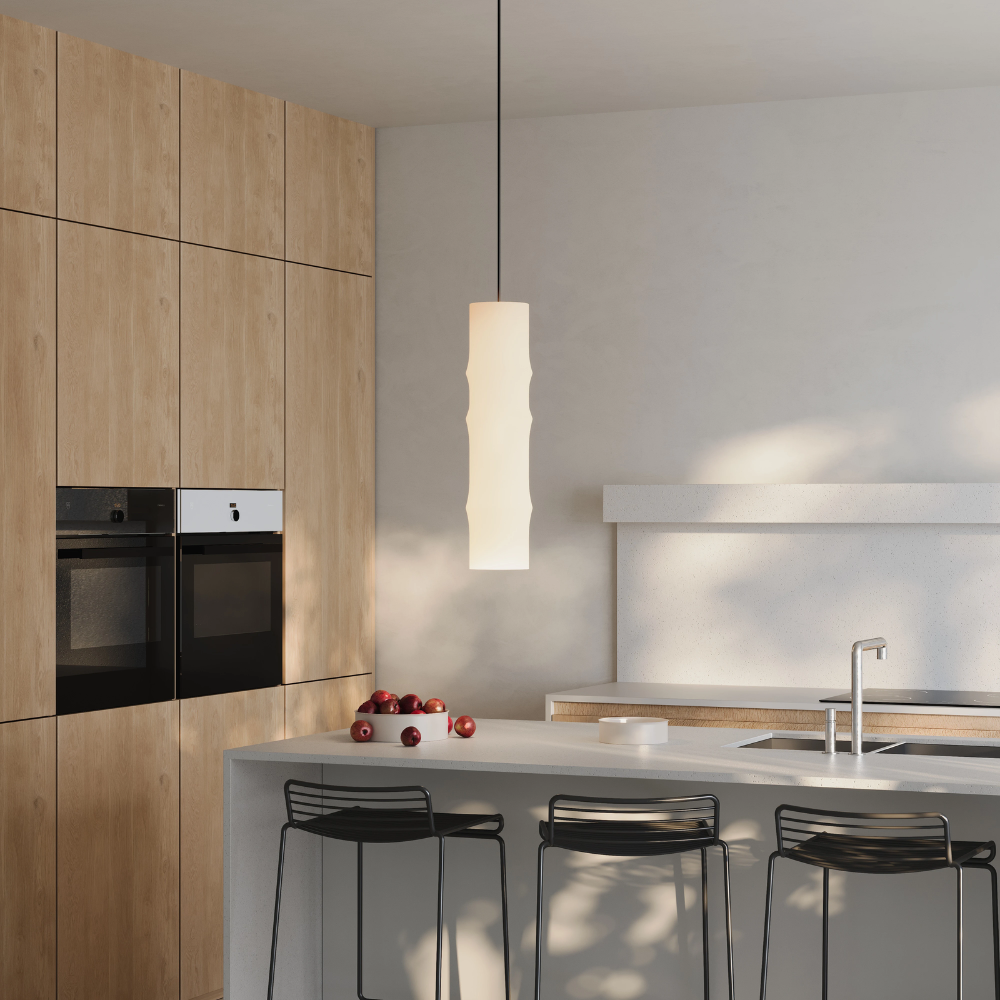 The Bamboo Large Pendant Light from Gantri with the black cord in a kitchen.