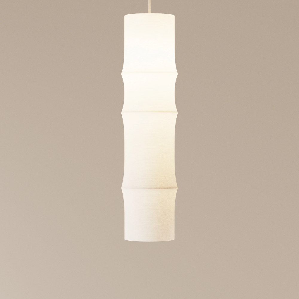 The Bamboo Large Pendant Light from Gantri with the white cord in a studio.