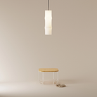 The Bamboo Medium Pendant Light from Gantri with the black cord inside a commercial office.