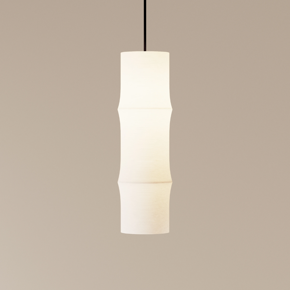The Bamboo Medium Pendant Light from Gantri with the black cord in a studio.