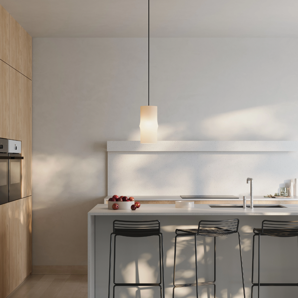 The Bamboo Small Pendant Light from Gantri with the black cord in a living area.