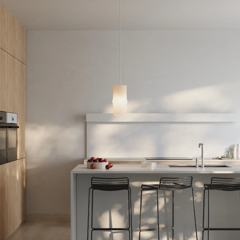 The Bamboo Small Pendant Light from Gantri with the white cord in a living room.