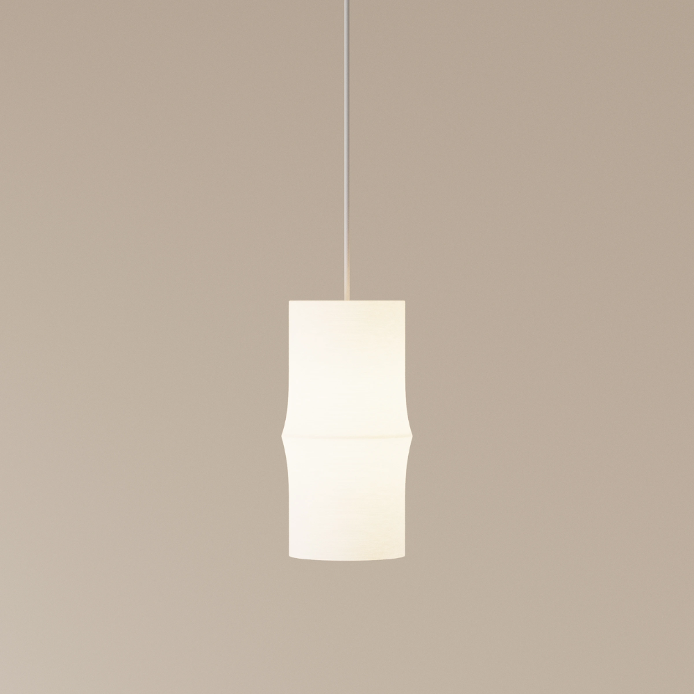 The Bamboo Small Pendant Light from Gantri with the white cord in a studio.