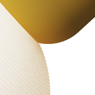The mustard Buia Pendant Light from Gantri close up.
