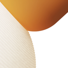 The persimmon Buia Pendant Light from Gantri close up.