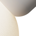 The stone Buia Pendant Light from Gantri close up.