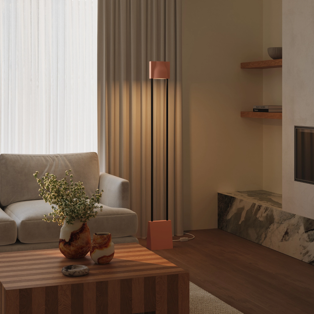 The blossom Carve Floor Light from Gantri with the black rod option in a living room.