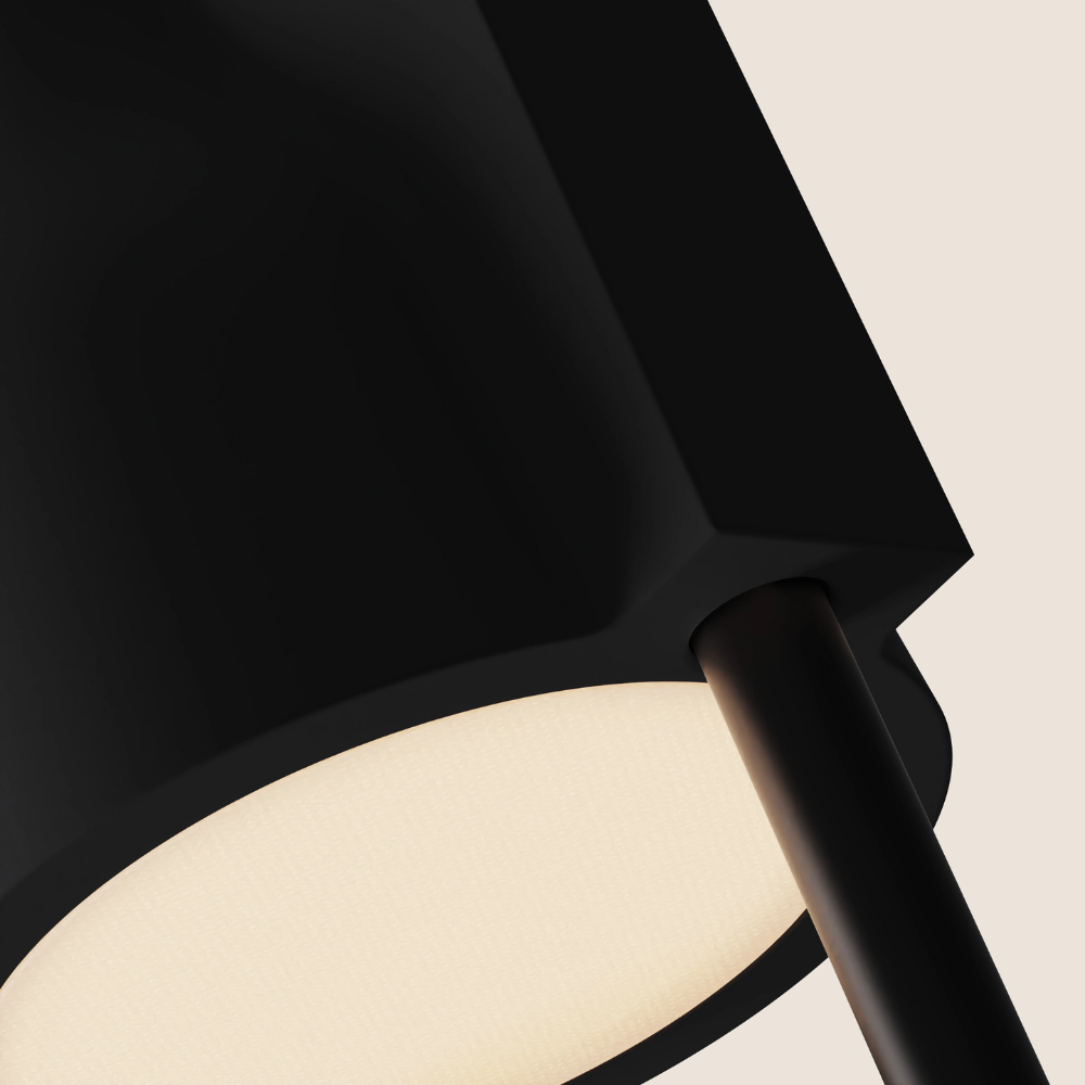 The carbon Carve Floor Light from Gantri with the black rod option close up.