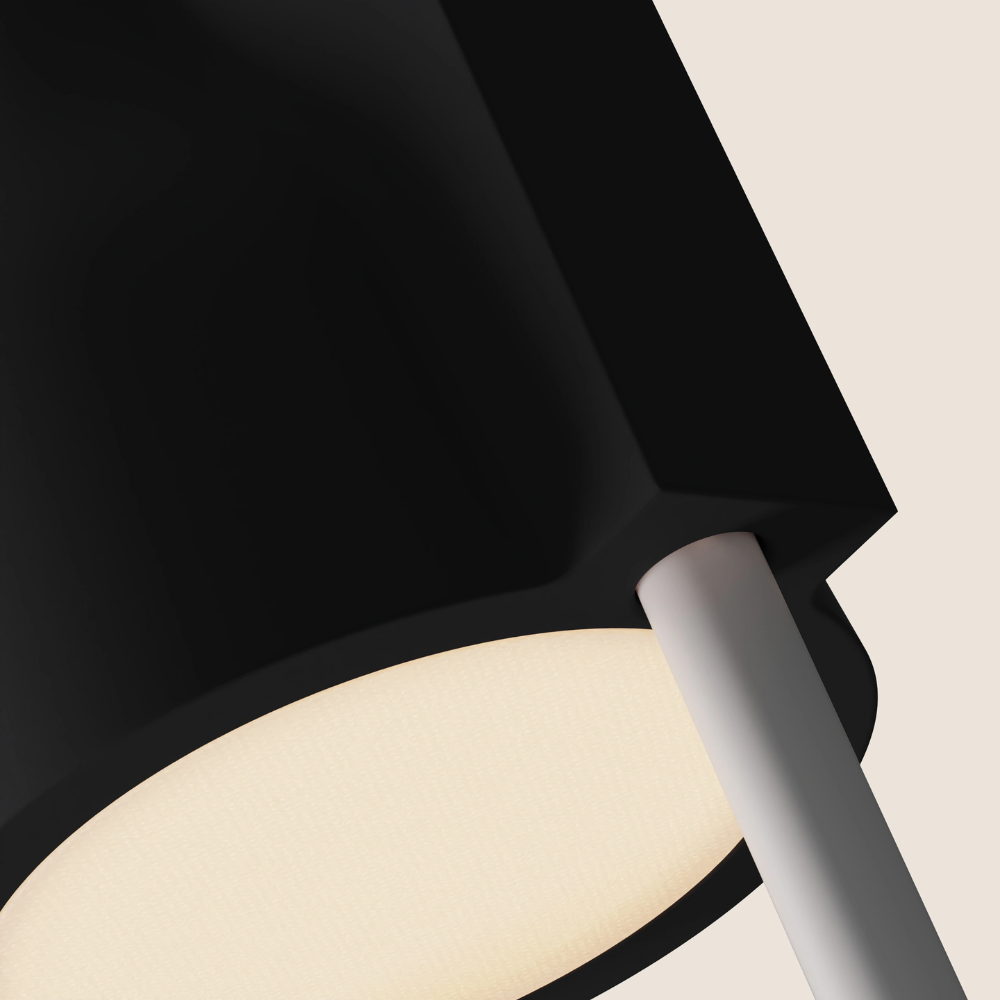 The carbon Carve Floor Light from Gantri with the white rod option close up.