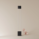 The carbon Carve Floor Light from Gantri with the white rod option.
