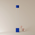 The cobalt Carve Floor Light from Gantri with the white rod option.