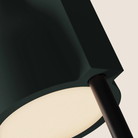 The forest Carve Floor Light from Gantri with the black rod option close up.