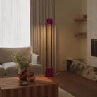 The hibiscus Carve Floor Light from Gantri with the black rod option in a living room.