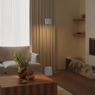 The mist Carve Floor Light from Gantri with the chrome rod option in a family space.