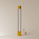 The mustard Carve Floor Light from Gantri with the black rod option.