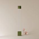 The olive Carve Floor Light from Gantri with the white rod option.