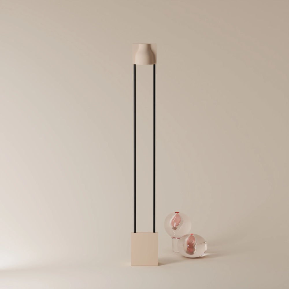 The peach Carve Floor Light from Gantri with the black rod option.