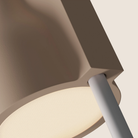 The peach Carve Floor Light from Gantri with the white rod option close up.