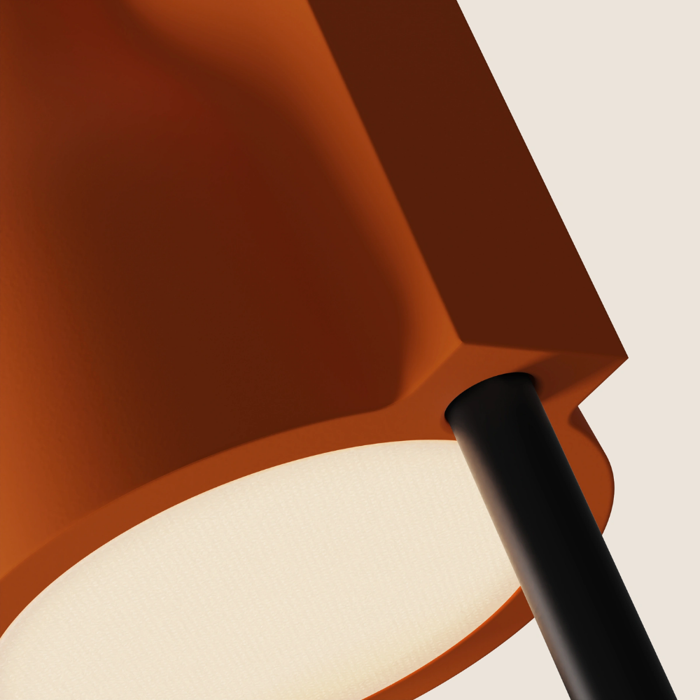 The persimmon Carve Floor Light from Gantri with the black rod option close up.