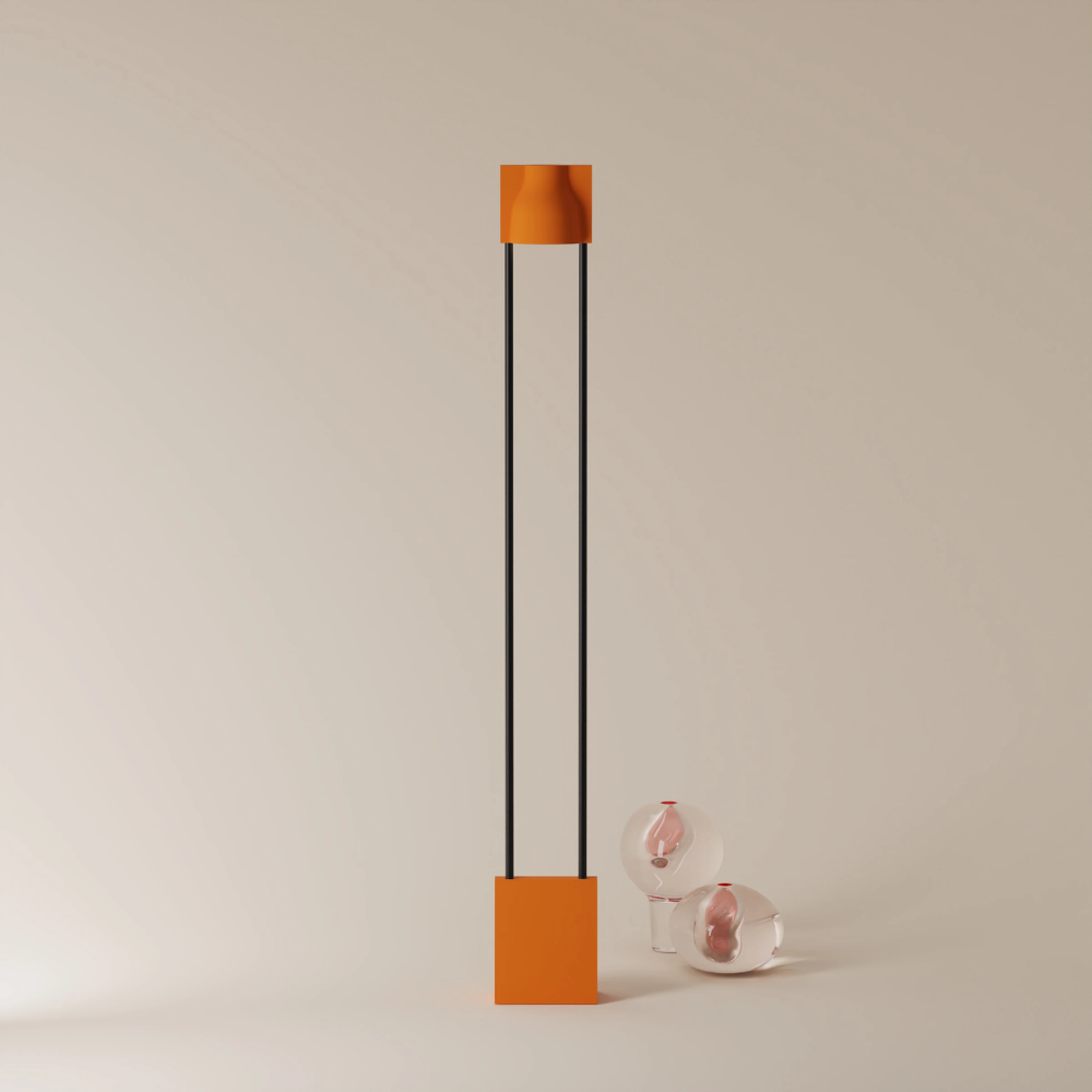 The persimmon Carve Floor Light from Gantri with the black rod option.