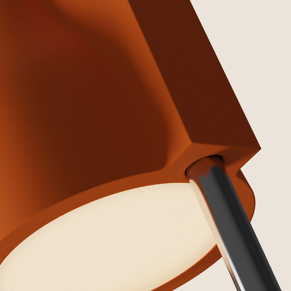 The persimmon Carve Floor Light from Gantri with the chrome rod option close up.