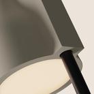 The sand Carve Floor Light from Gantri with the black rod option close up.