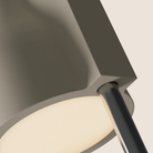 The sand Carve Floor Light from Gantri with the chrome rod option close up.