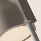 The sand Carve Floor Light from Gantri with the white rod option close up.