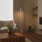 The sand Carve Floor Light from Gantri with the white rod option in a living space.