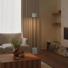 The sky Carve Floor Light from Gantri with the black rod option in a living room.