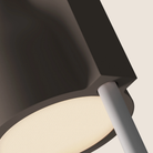 The smoke Carve Floor Light from Gantri with the white rod option close up.