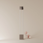 The smoke Carve Floor Light from Gantri with the white rod option.