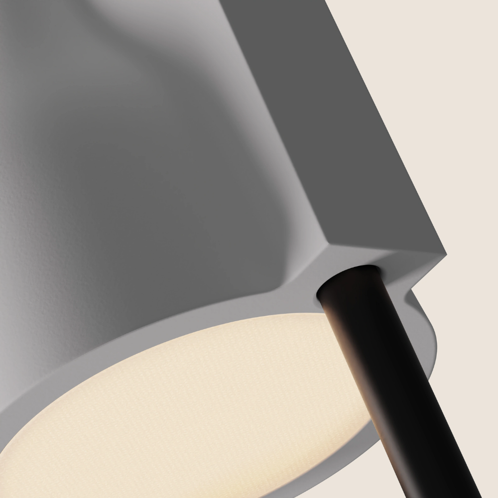 The snow Carve Floor Light from Gantri with the black rod option close up.