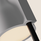 The snow Carve Floor Light from Gantri with the black rod option close up.