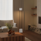 The stone Carve Floor Light from Gantri with the black rod option in a living room.
