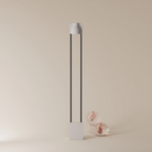 The stone Carve Floor Light from Gantri with the black rod option.