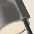 The stone Carve Floor Light from Gantri with the chrome rod option close up.