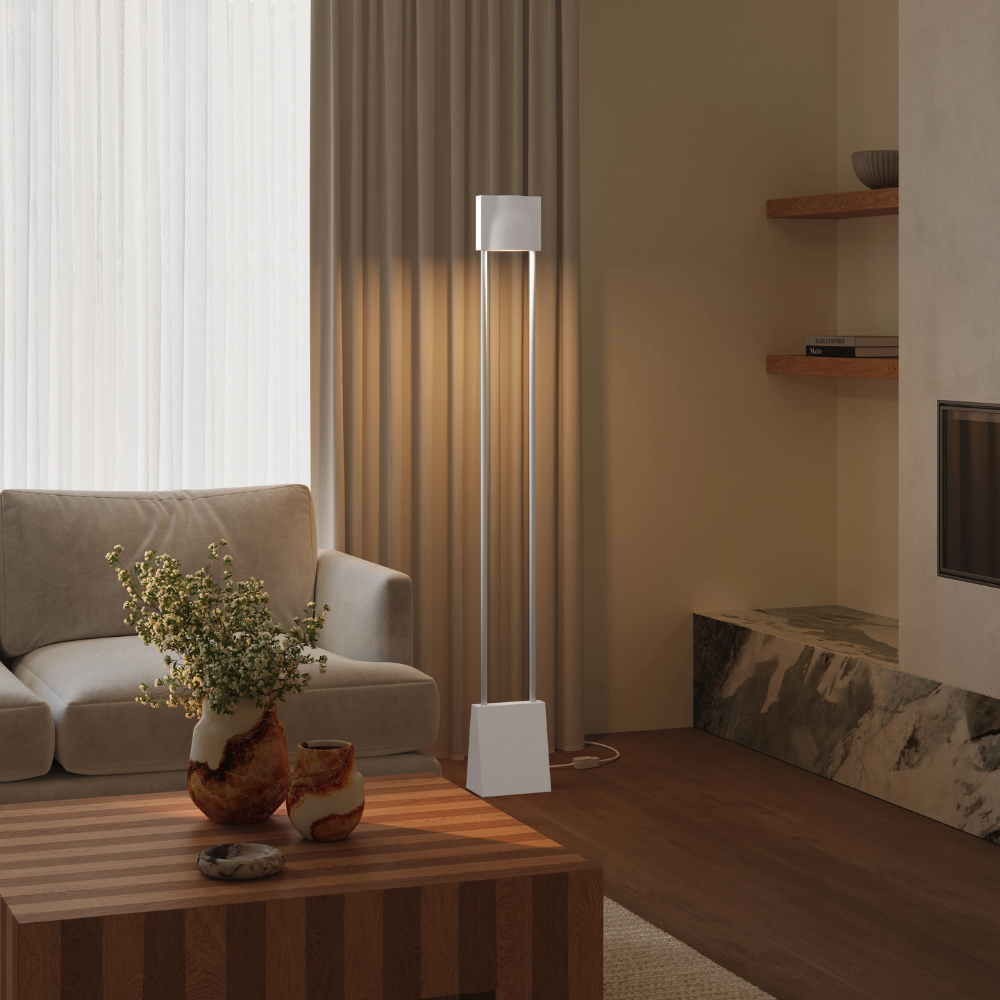 The stone Carve Floor Light from Gantri with the white rod option in a living space.