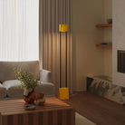 The sunrise Carve Floor Light from Gantri with the black rod option in a living room.