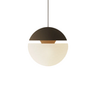 The walnut Cora Pendant Light from Gantri with the white cord.