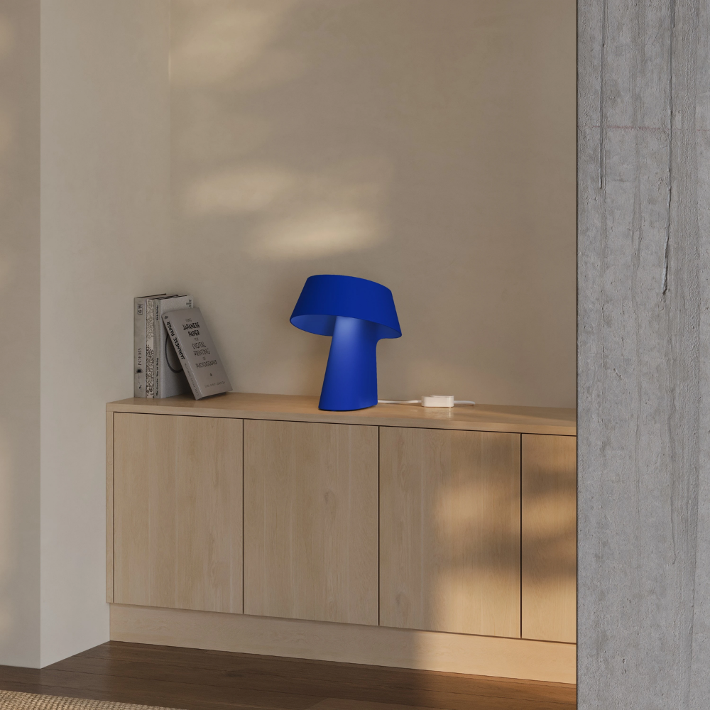 The cobalt Fold Table Light from Gantri in a living room.