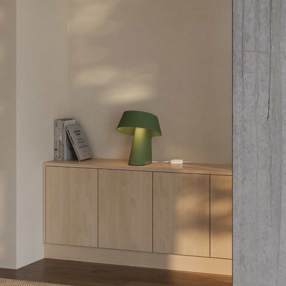 The olive Fold Table Light from Gantri in a living room.