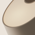 The peach Fold Table Light from Gantri close up.