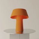 The persimmon Fold Table Light from Gantri.