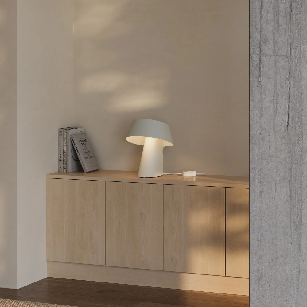 The sand Fold Table Light from Gantri in a living room.