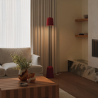 The canyon Gio Floor Light from Gantri with the black rod option in a living room near a couch.