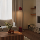 The canyon Gio Floor Light from Gantri with the chrome rod option in a family space beside a sofa.